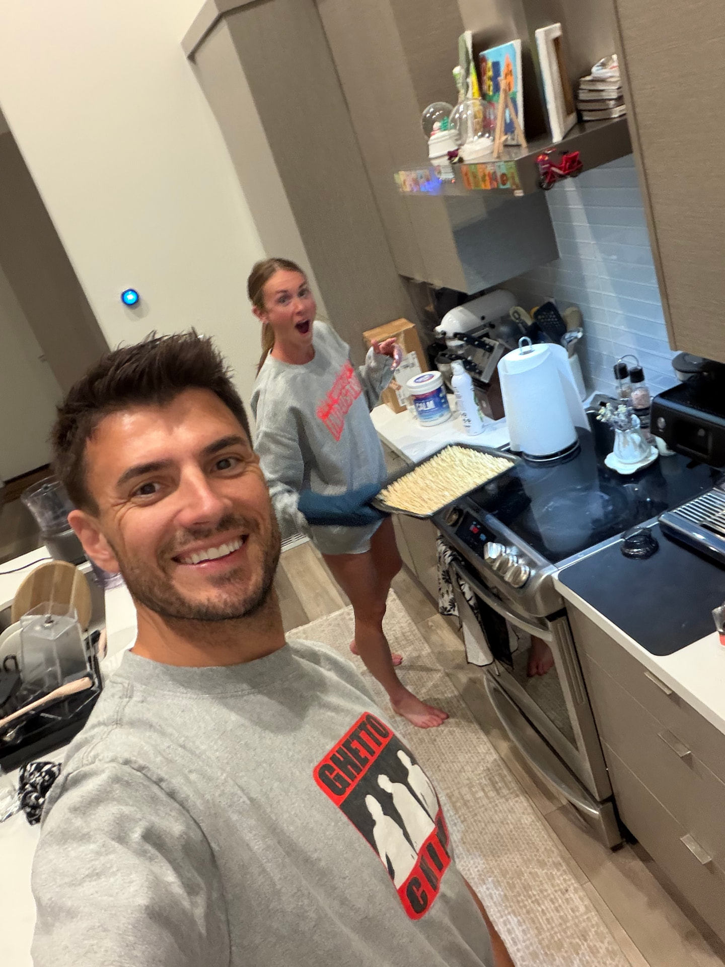 Jordan and Emily making peanut butter in their kitchen
